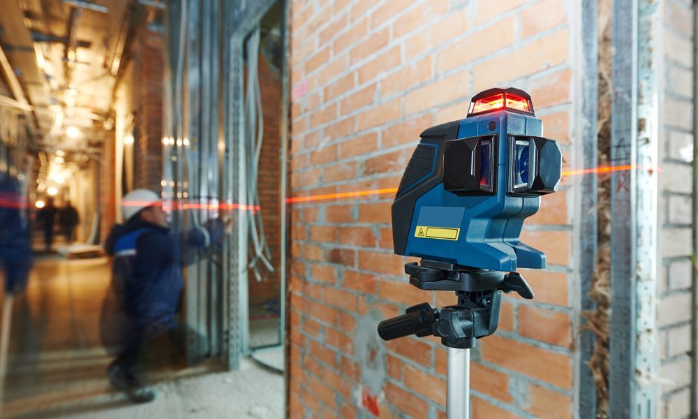 workman using a laser level