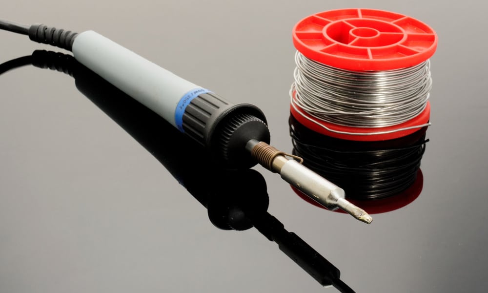 soldering iron with a reel of solder wire