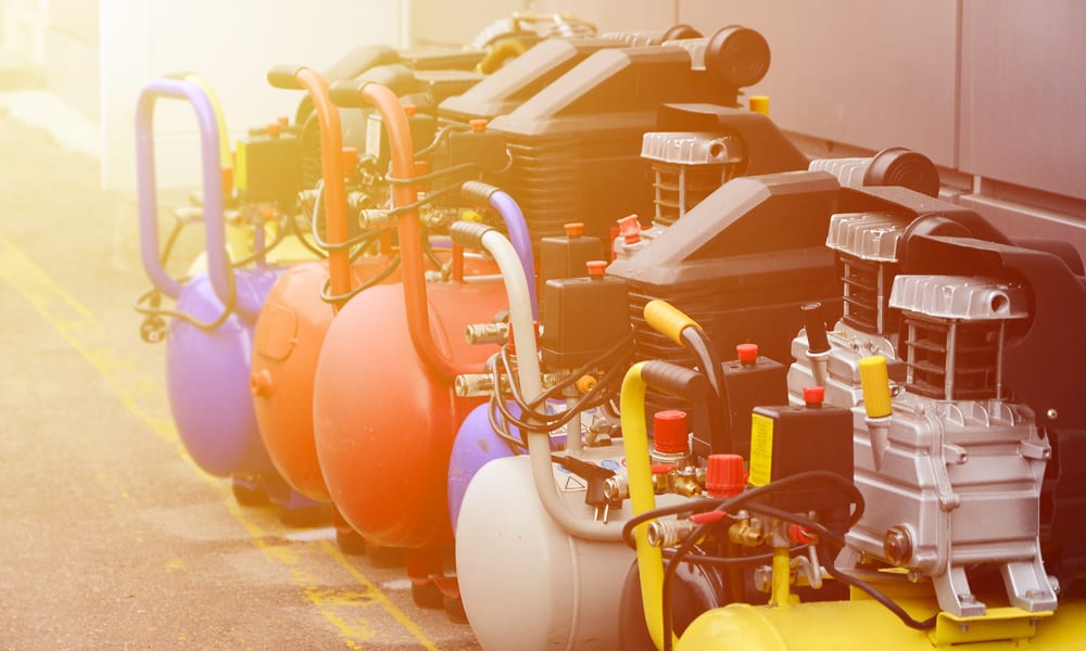 a row of different color Air Compressors
