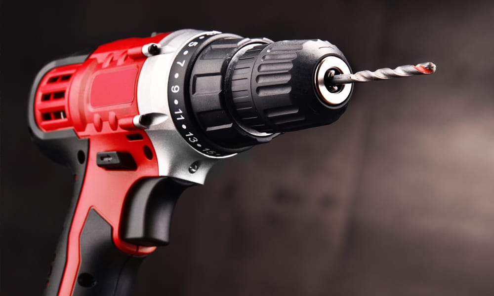 A cordless drill with a drill piece inserted