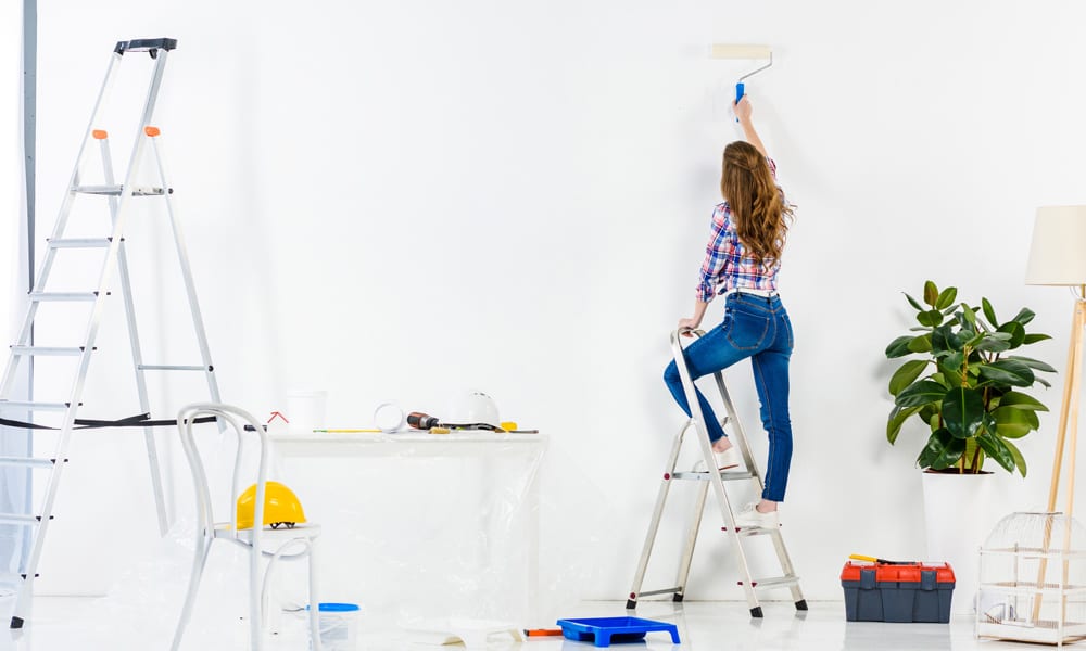 woman paint on a step ladders