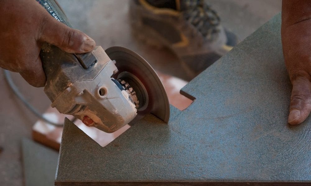 angle grinder cutting a tile