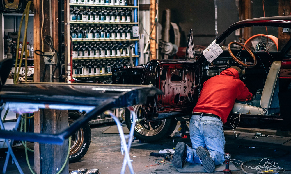 guy working on a car