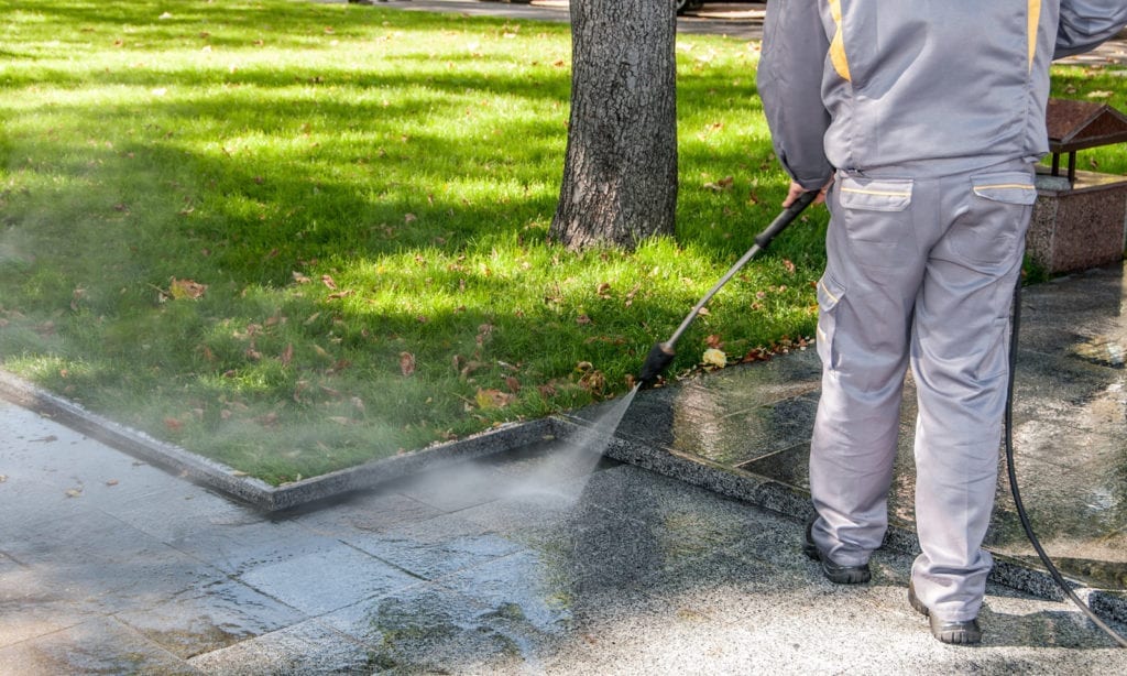 pressure washer cleaning paving stones