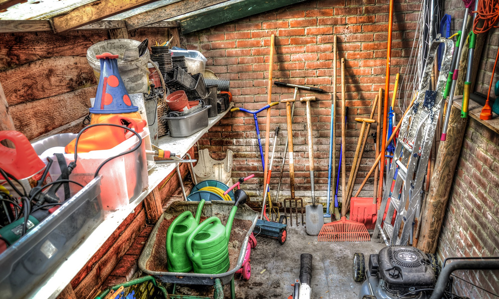 a shed with lots of different garden tools
