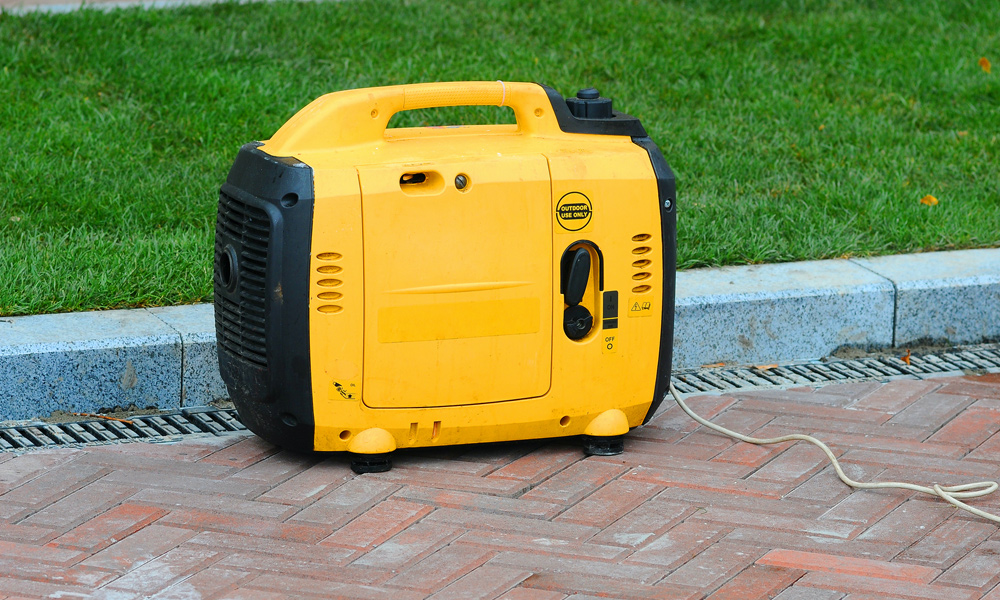 A inverter generator sitting on a driveway