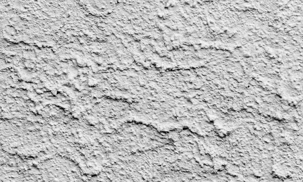 A white textured concrete wall