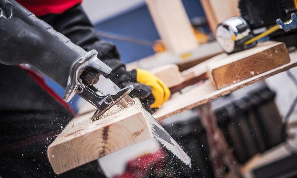 Reciprocating Saw blade cutting through wood