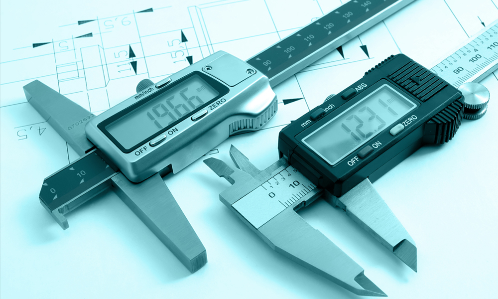 two digital Calipers laying side by side