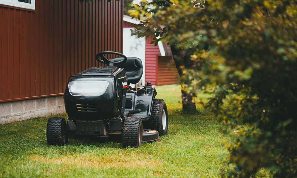 Riding lawn mower on grass