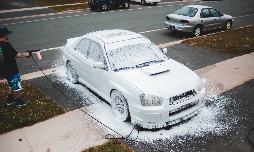 Car covered in soap foam 
